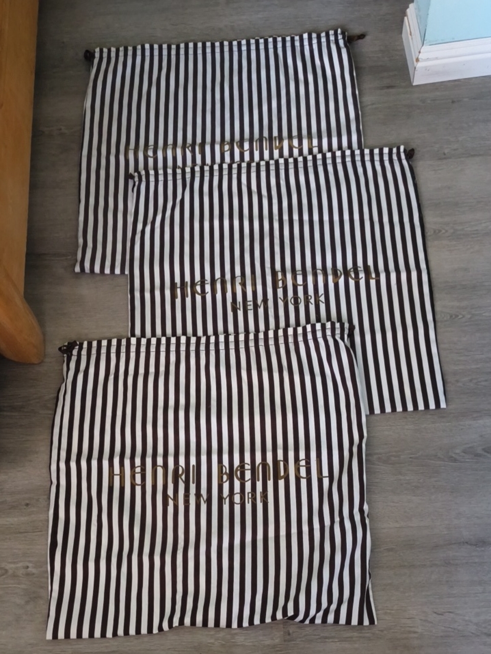 Lot of three 23" x 23" Henri Bendel dust bags